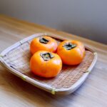 ざるに盛った種なし柿 グリーンジャンクション